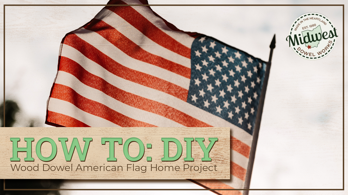 An American flag blowing in the wind with the text, "How to: DIY Wood Dowel American Flag Home Project"
